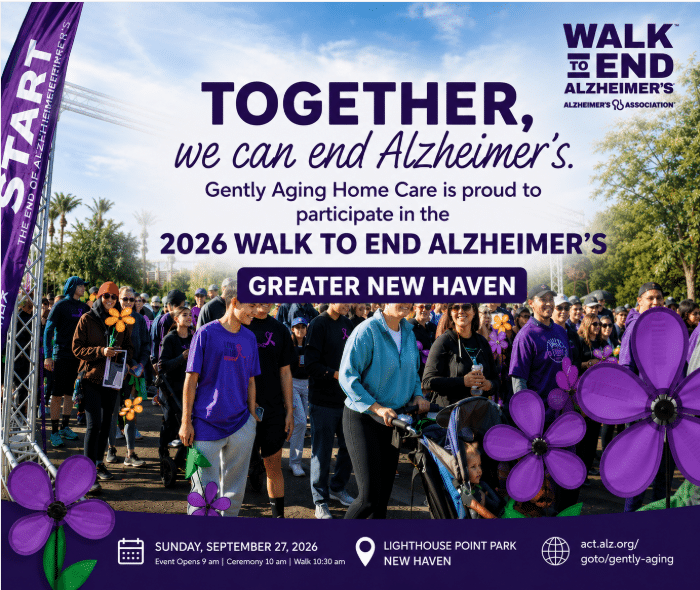 Crowd at the 2026 Walk to End Alzheimer's in Greater New Haven, with purple flowers and banners.